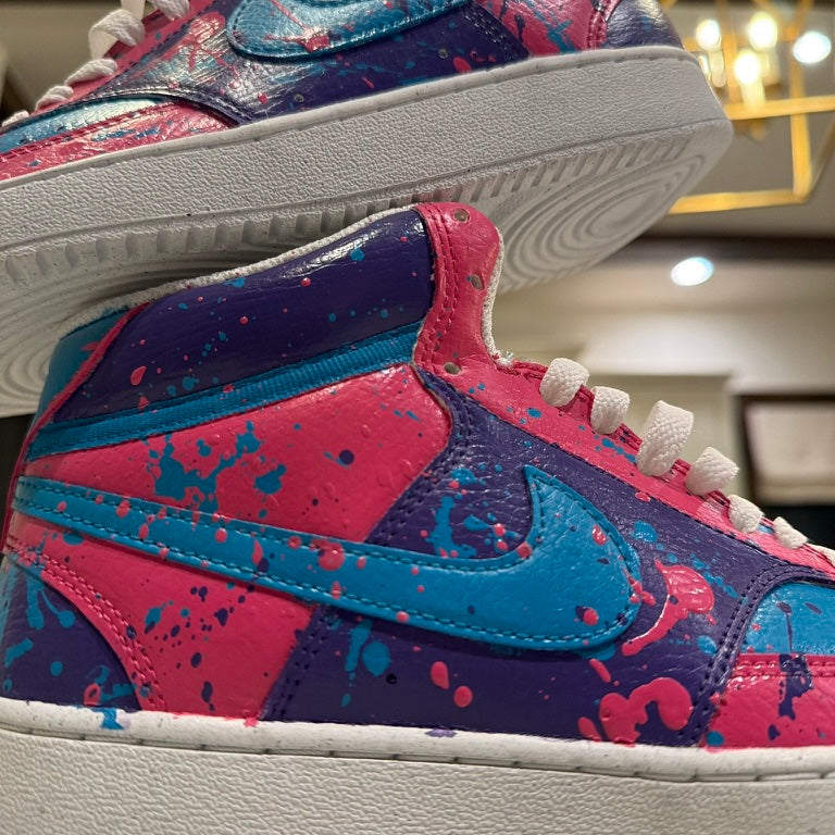 Close-up of freehand splatter paint on the blue swoosh of № 002 — Second Coat